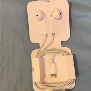 White Apple earphones with lightning connector